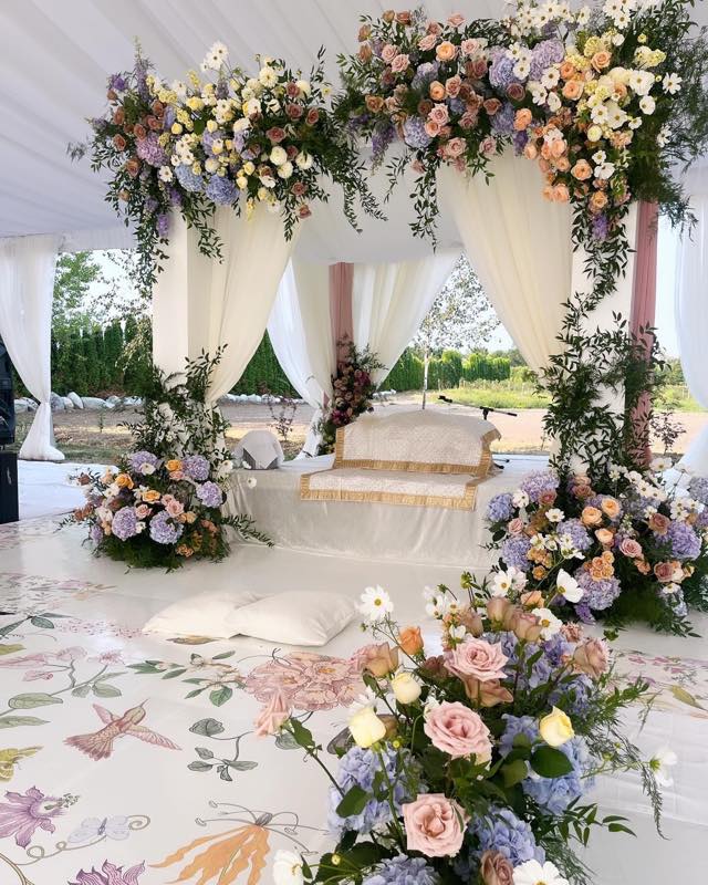 Blush pink roses and pillar candles in intimate event setting by InStyle Events